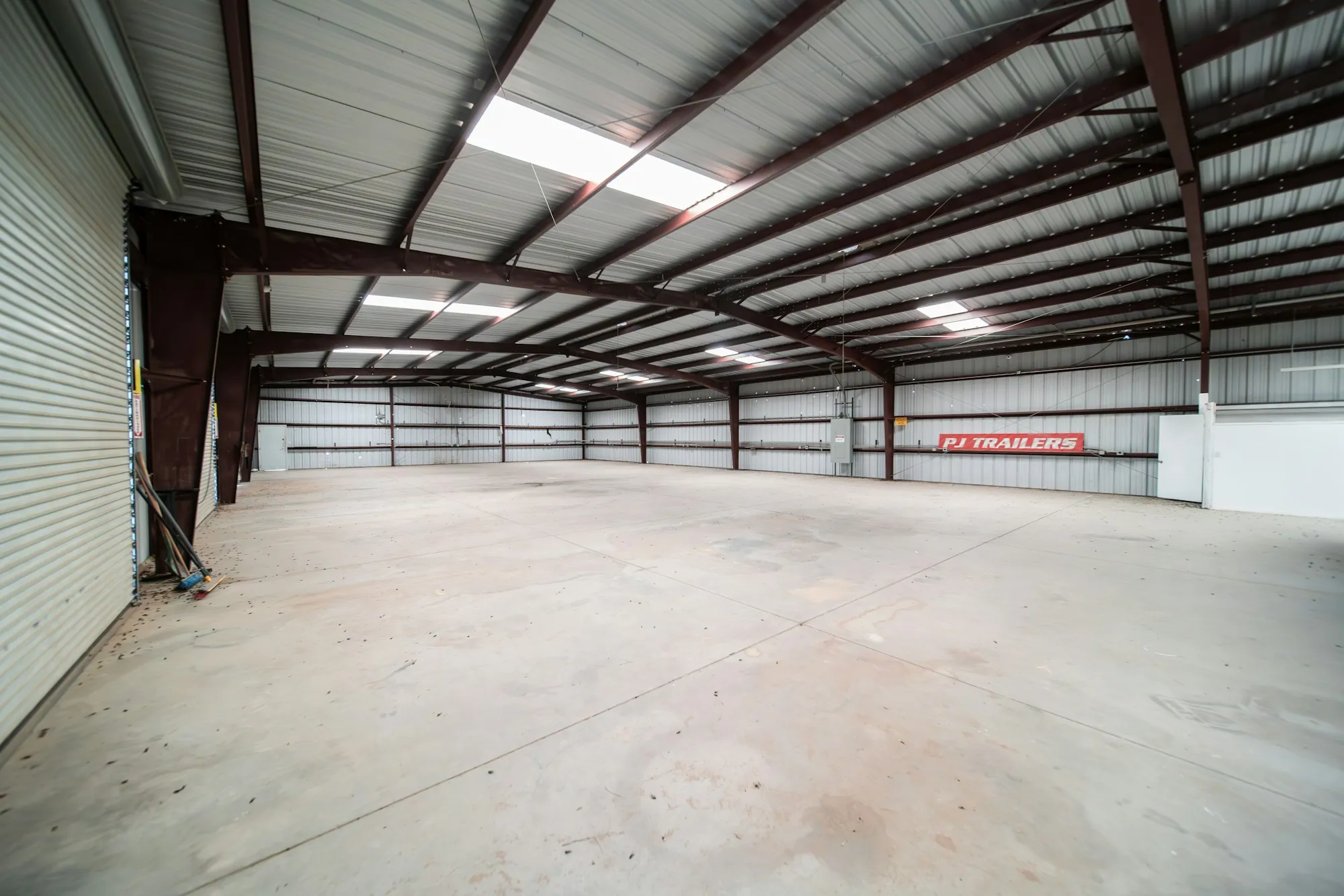 Clean warehouse interior with roll-up doors